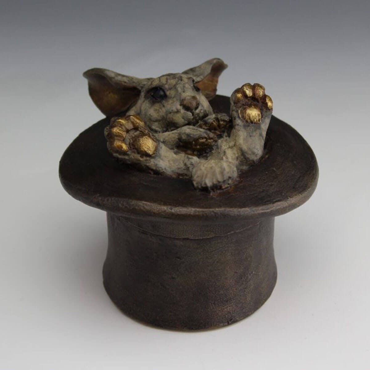 Magician's Assistant bronze bunny in a top hat sculpture by Mark Dziewior at 7 Mile Creek Studio.