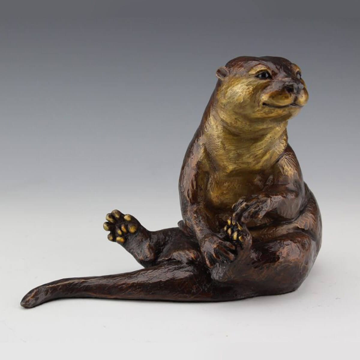 Otterly Lovable bronze otter sculpture by Mark Dziewior at 7 Mile Creek Studio.