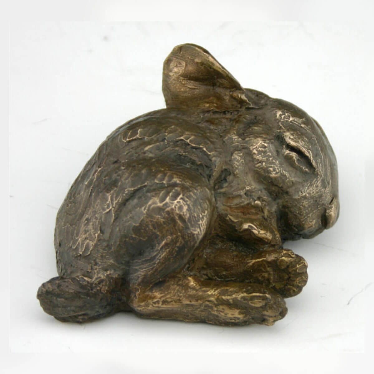 Sleeping Bunny bronze sculpture by Mark Dziewior at 7 Mile Creek Studio.